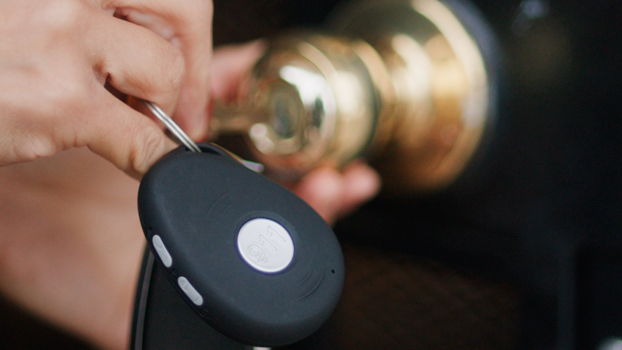 PanicTap clipped to keychain at door